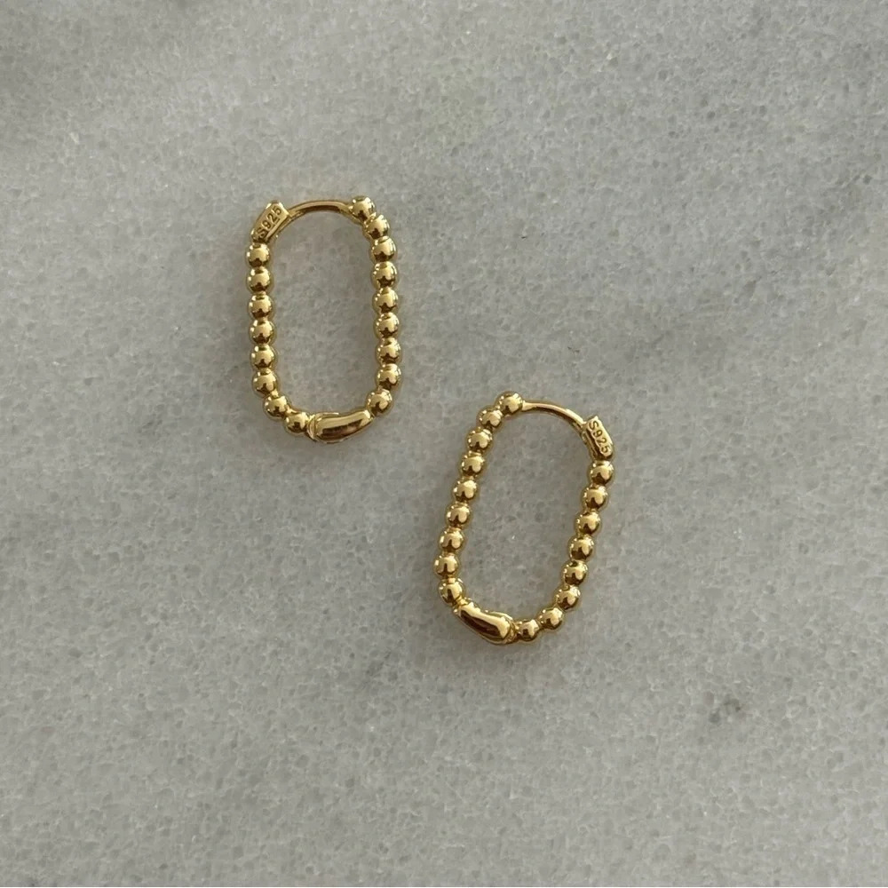 Gold Beaded Oval Hoop Earrings
Brand New - Picture 1 of 3